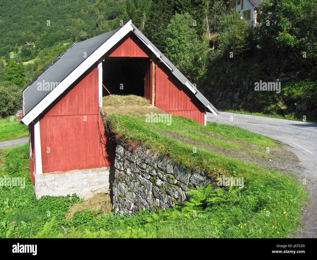 Beautiful entry to red barn. Norway. Stock Photo