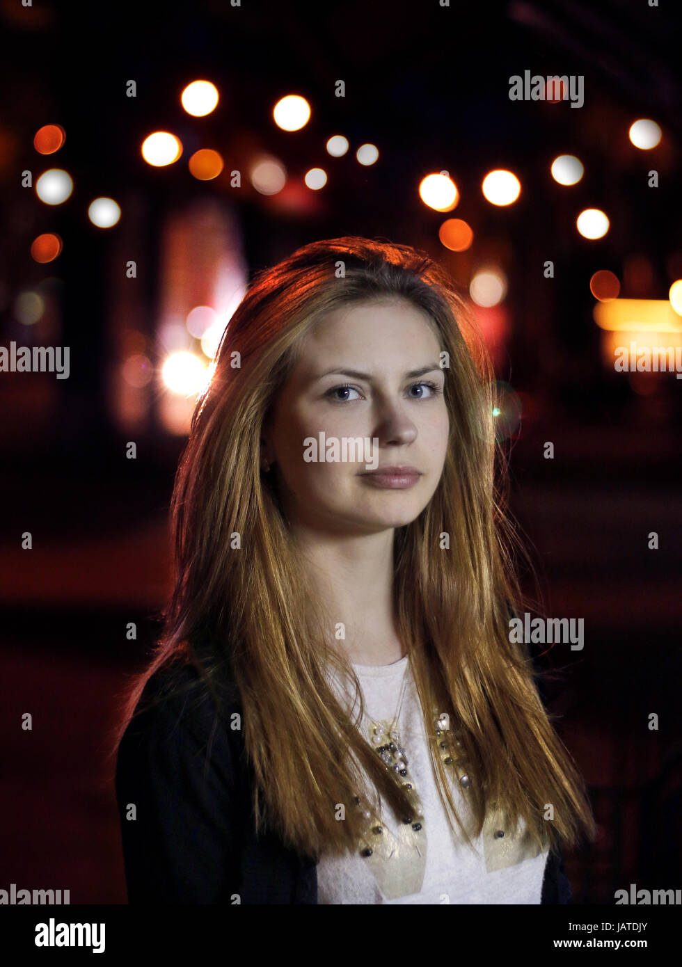 portrait of a young pretty girl in the street at night Stock Photo - Alamy