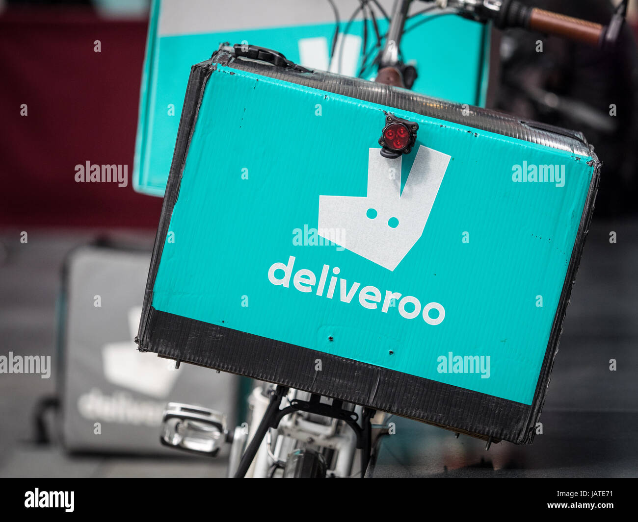 Deliveroo food delivery bikes at London's Spitalfields Market. Deliveroo is competing with Uber Eats in the lucrative food delivery market Stock Photo