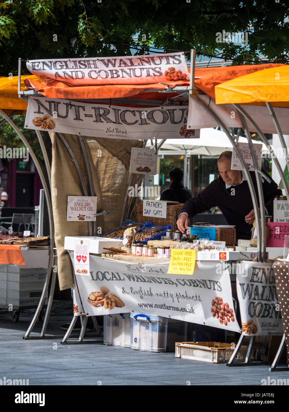 An English Walnut and Cobnut product stall in Spitalfields Market in East London. Stock Photo