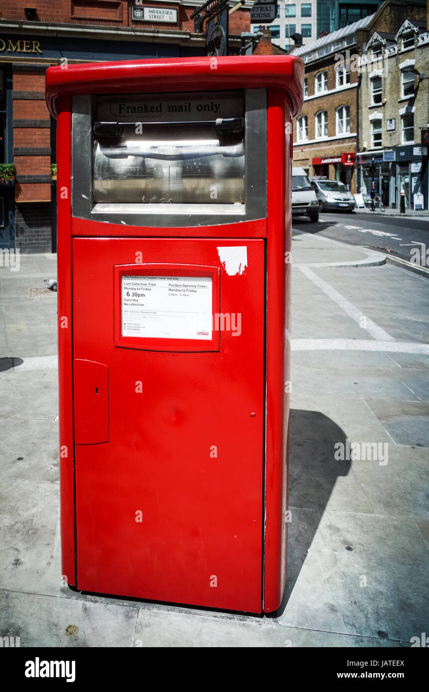 A Franked Mail (business mail) Royal Mail Post Box in East London, UK. Stock Photo