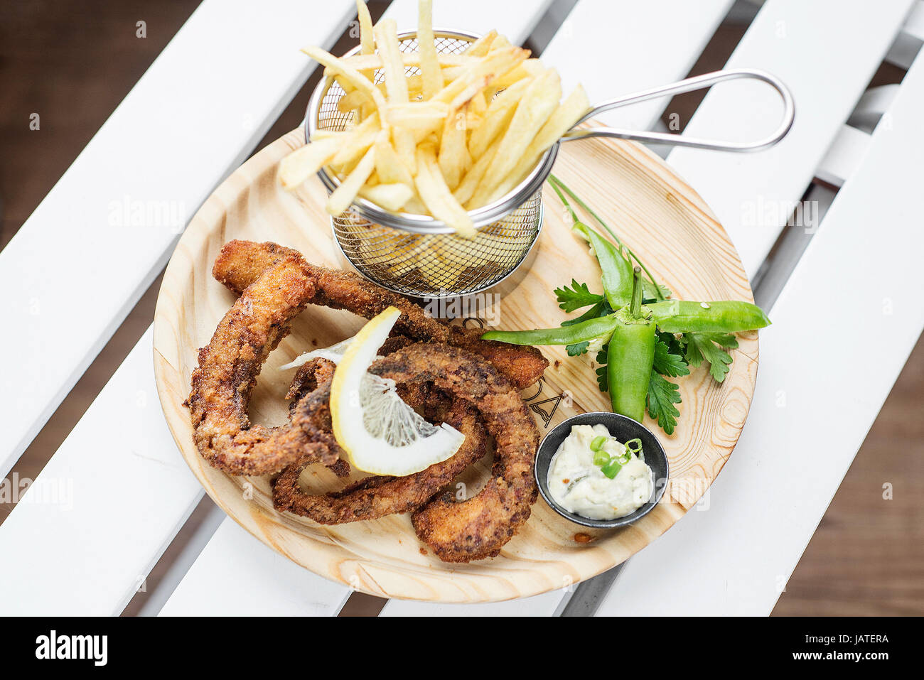 fried octpus seafood rings calamari style with fries tapas snack set Stock Photo