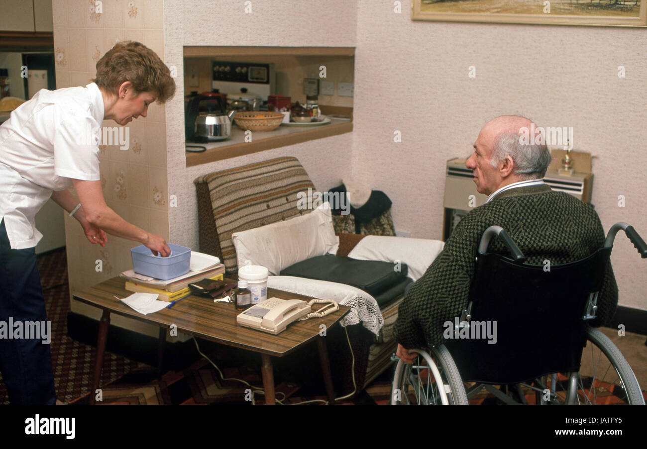 home help carers district nurse on a home visit to elderly man in sheltered accommodation Stock Photo