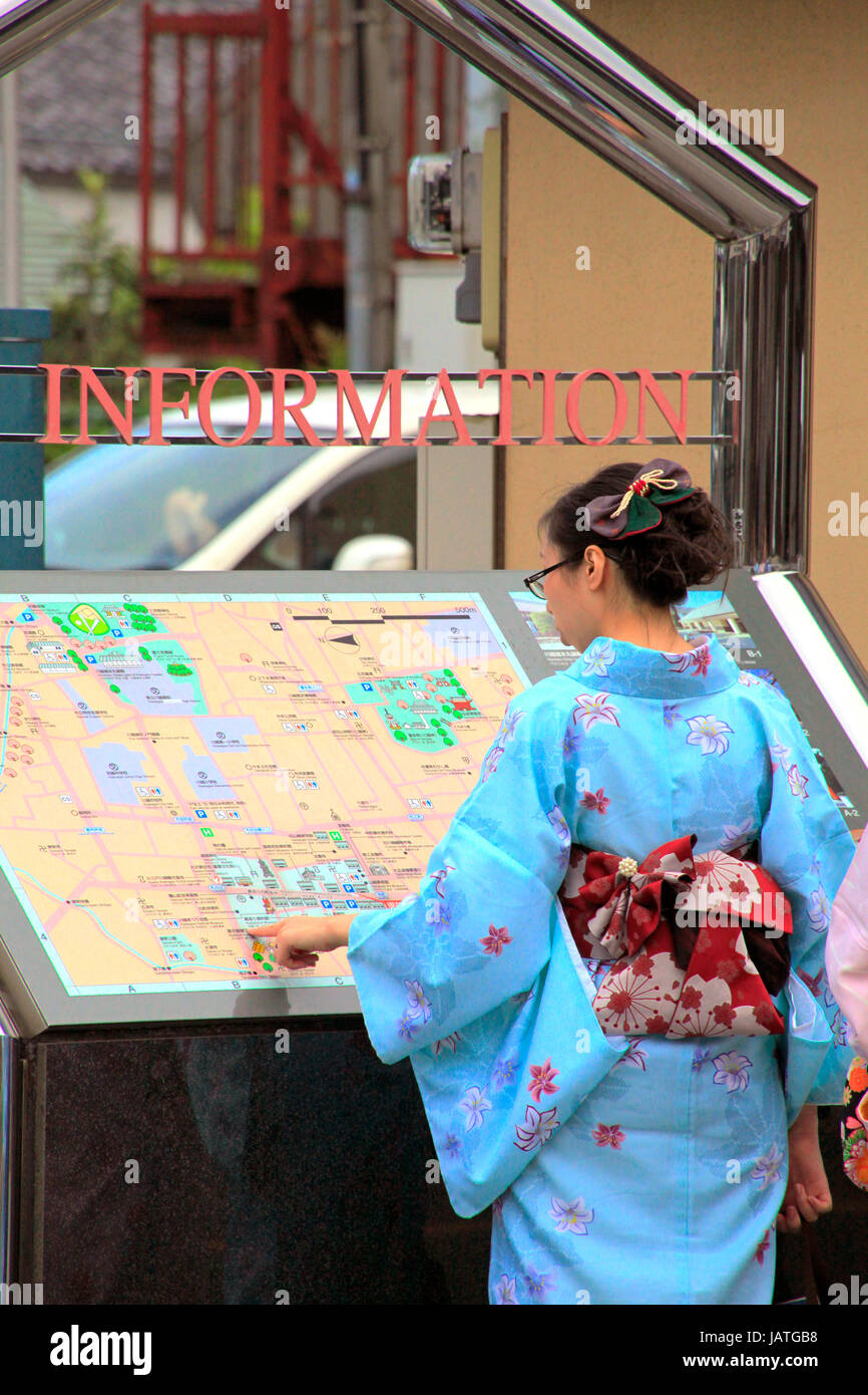 Kimono Women Looking at Information Board on a Street in Historical Old Town Kawagoe Saitama Japan Stock Photo