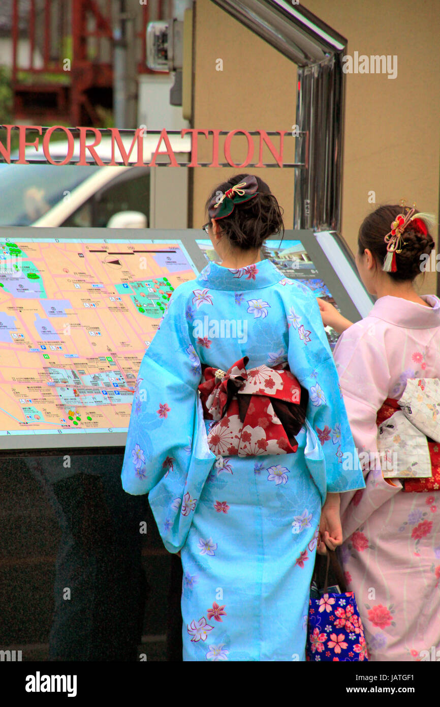 Kimono Women Looking at Information Board on a Street in Historical Old Town Kawagoe Saitama Japan Stock Photo