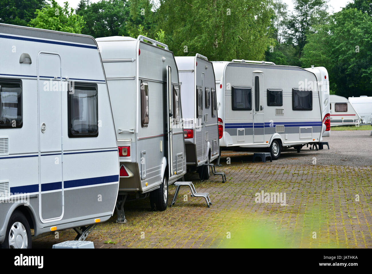 New touring caravans parked in a row on a caravan trade park Stock Photo