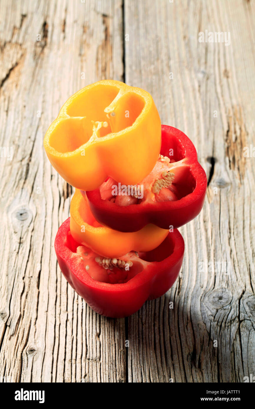 Halves of fresh red and yellow peppers Stock Photo - Alamy