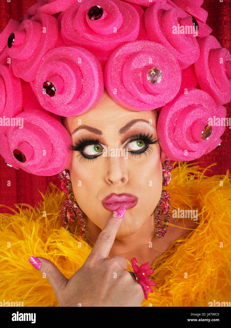 Fancy drag queen with finger on lips Stock Photo Alamy