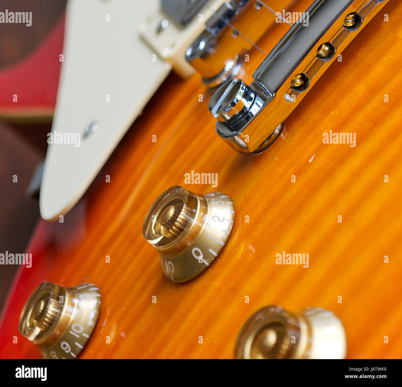 closeup of a guitar bridge with control knobs Stock Photo Alamy
