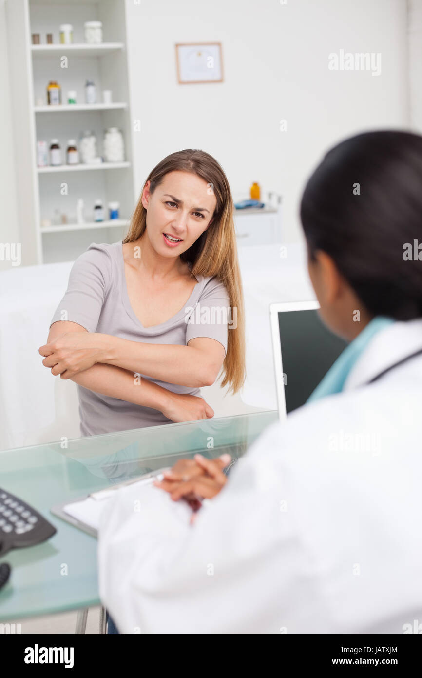 Patient explaining elbow pain hi-res stock photography and images - Alamy
