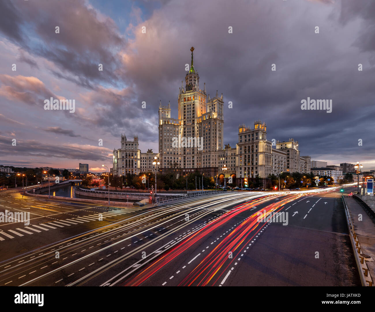 Skyscraper on Kotelnicheskaya Embankment and Traffic Trails at Dusk, Moscow, Russia Stock Photo