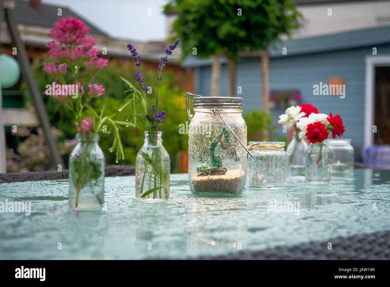 Graden Decor For Raining Decorated garden table during heavy rain Stock Photo - Alamy