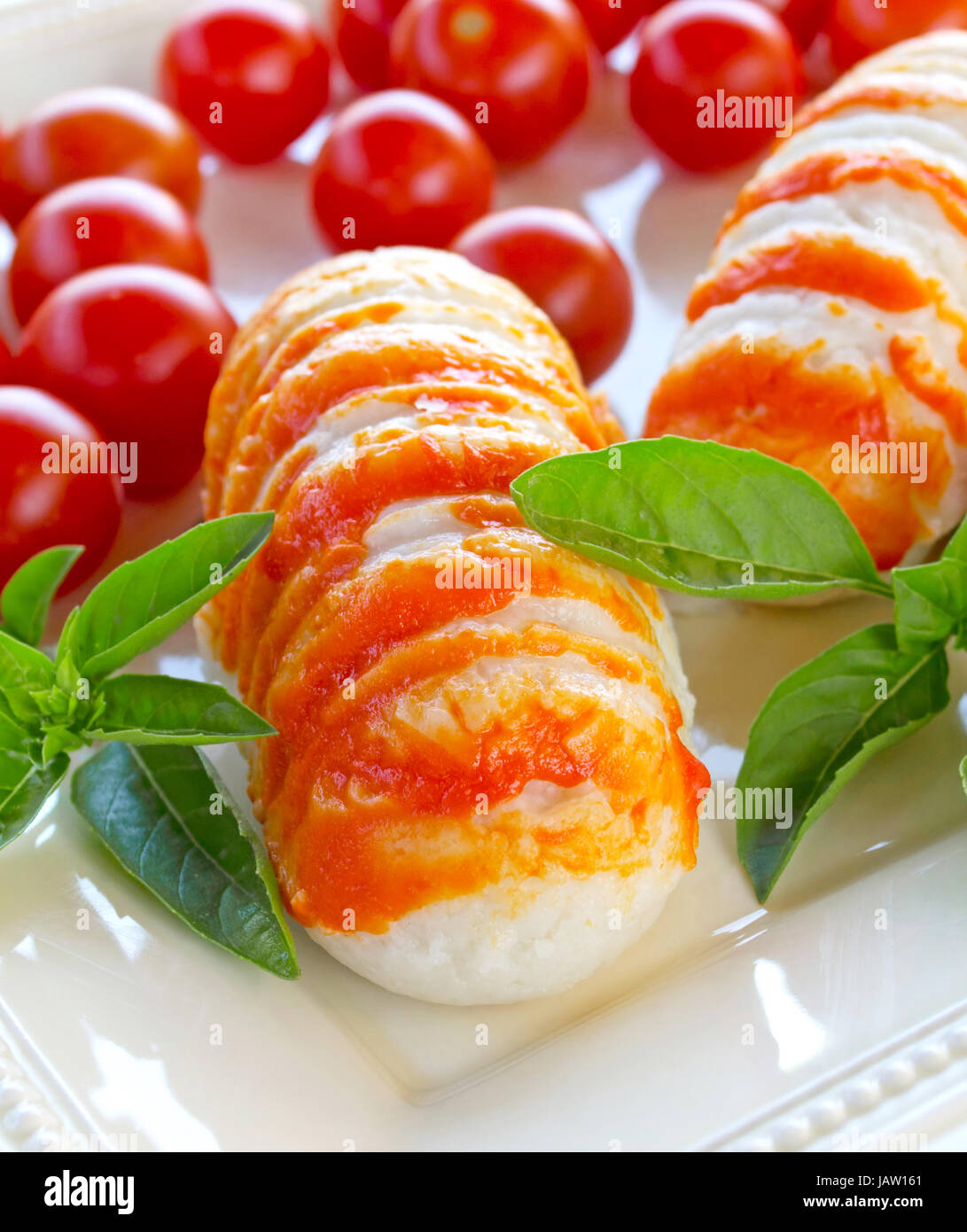 plate of surimi lobster, tomatoes and basil Stock Photo Alamy