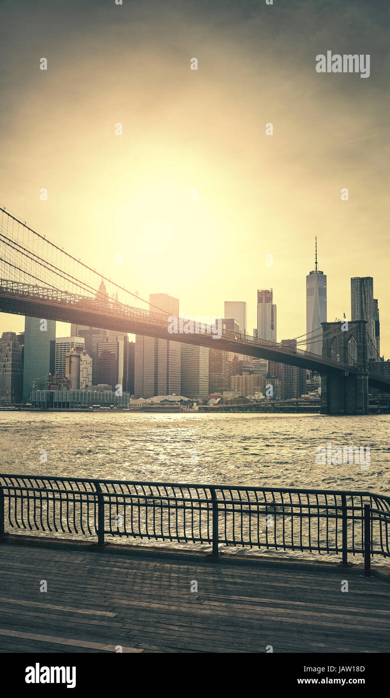 Retro toned sunset over Manhattan and Brooklyn Bridge, New York City, USA. Stock Photo