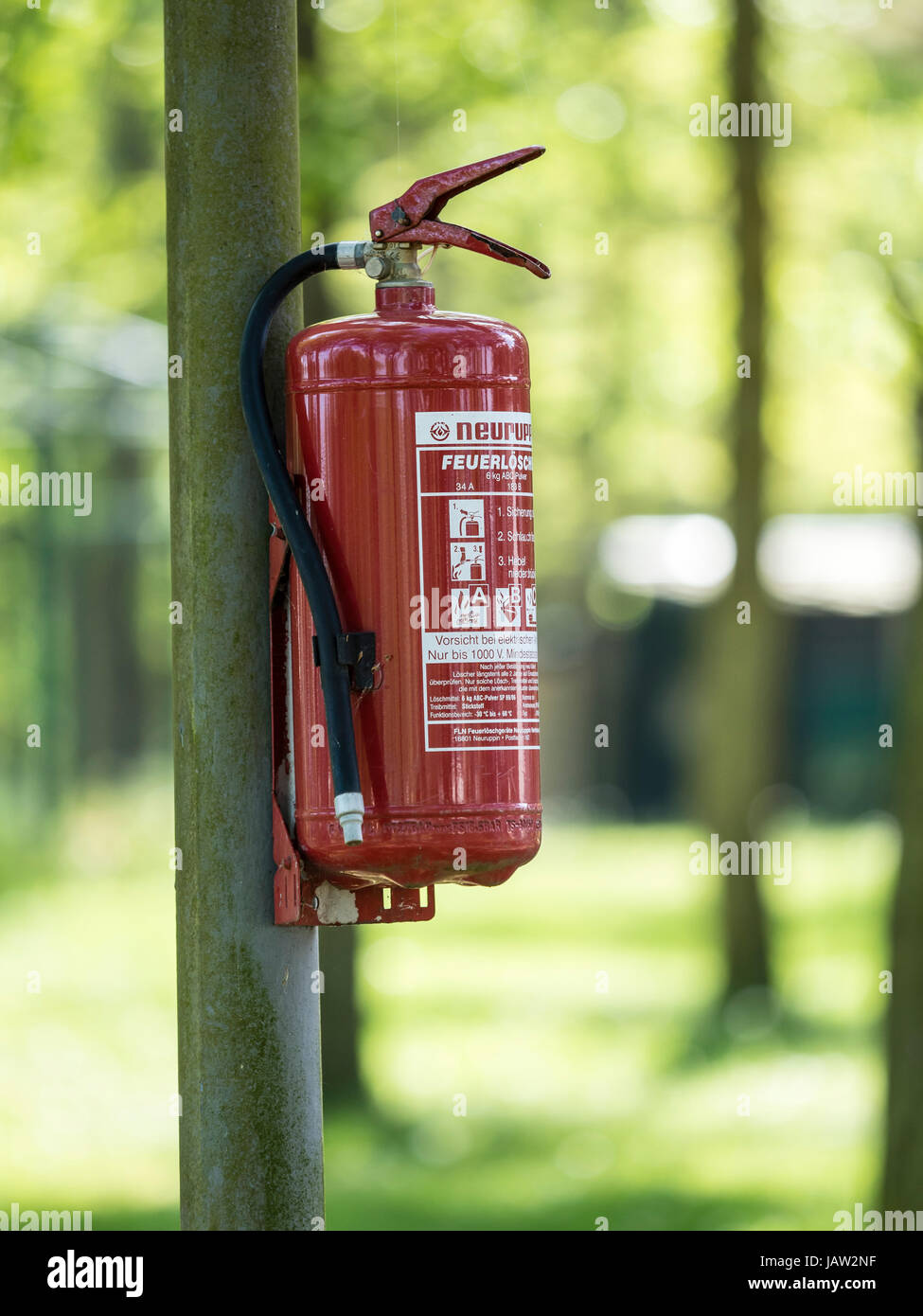 Fire extinguisher mounted on campsite, Bodstedt,  Baltic Sea, peninsula of Fischland-Darß-Zingst, Zingst, Mecklenburg-Vorpommern, Germany Stock Photo
