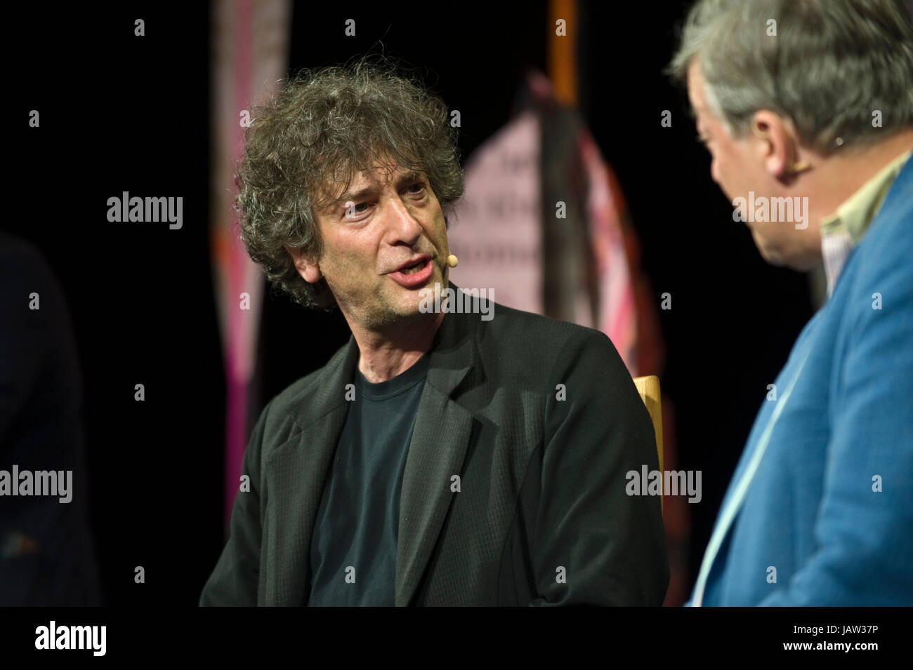 Neil Gaiman speaking to Stephen Fry on stage at Hay Festival 2017 Hay-on-Wye Powys Wales UK Stock Photo