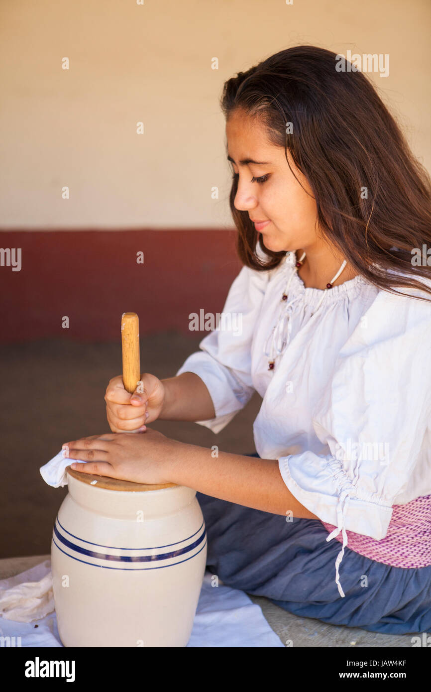 young girl churning butter, La Purisima Mission State Historic Park