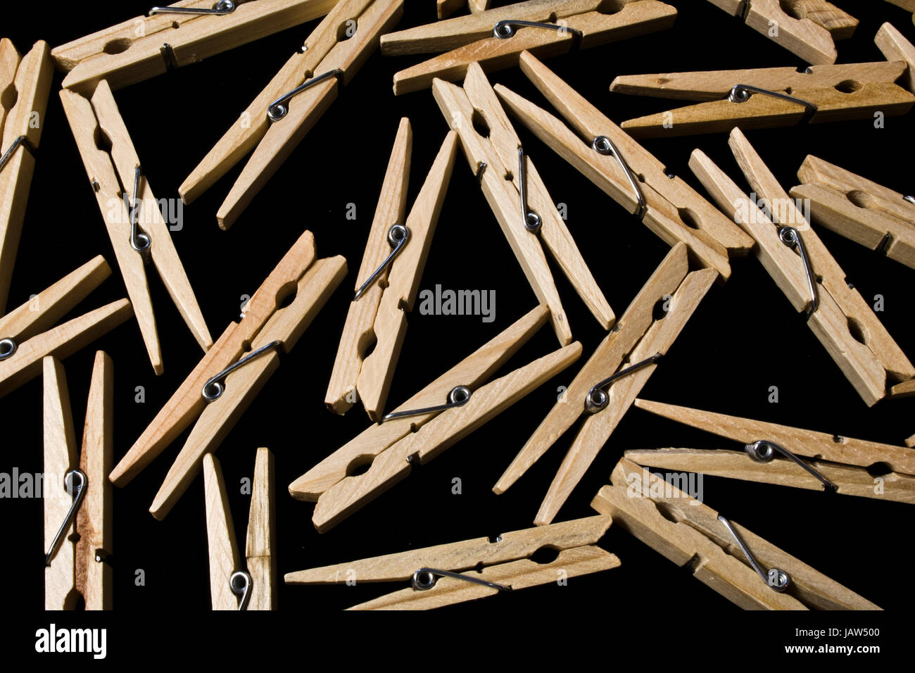 Collection of Wooden Clothes pegs on Black Background Stock Photo Alamy
