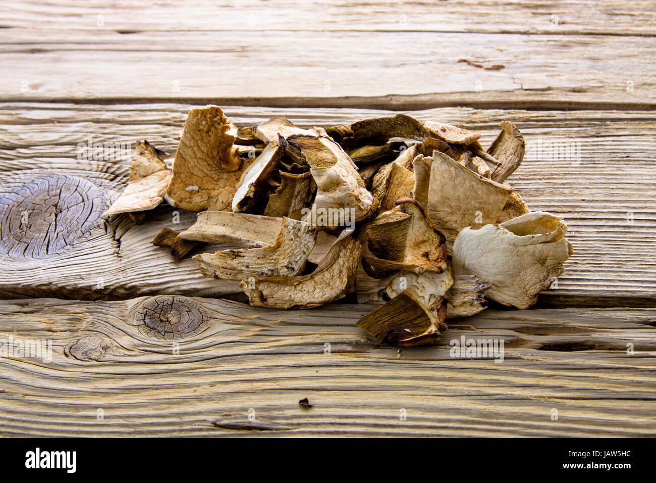 Dried porcini mashrooms on old wooden board Stock Photo