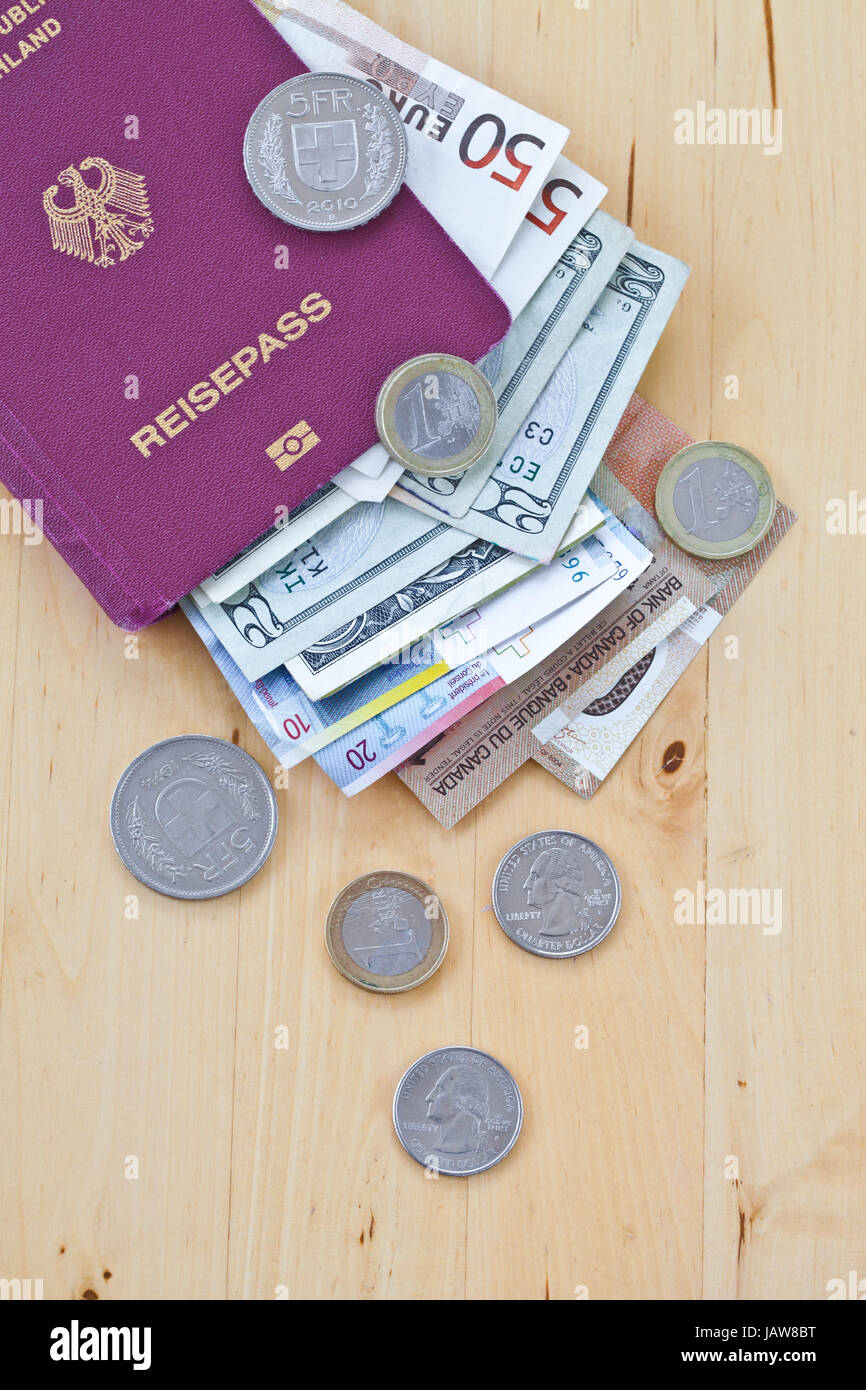 Deutscher Reisepass mit verschiedenen Waehrungen Stock Photo