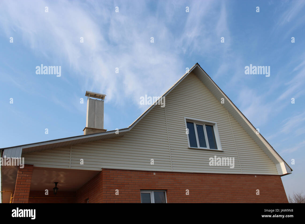 new private modern house on the blue sky background Stock Photo - Alamy