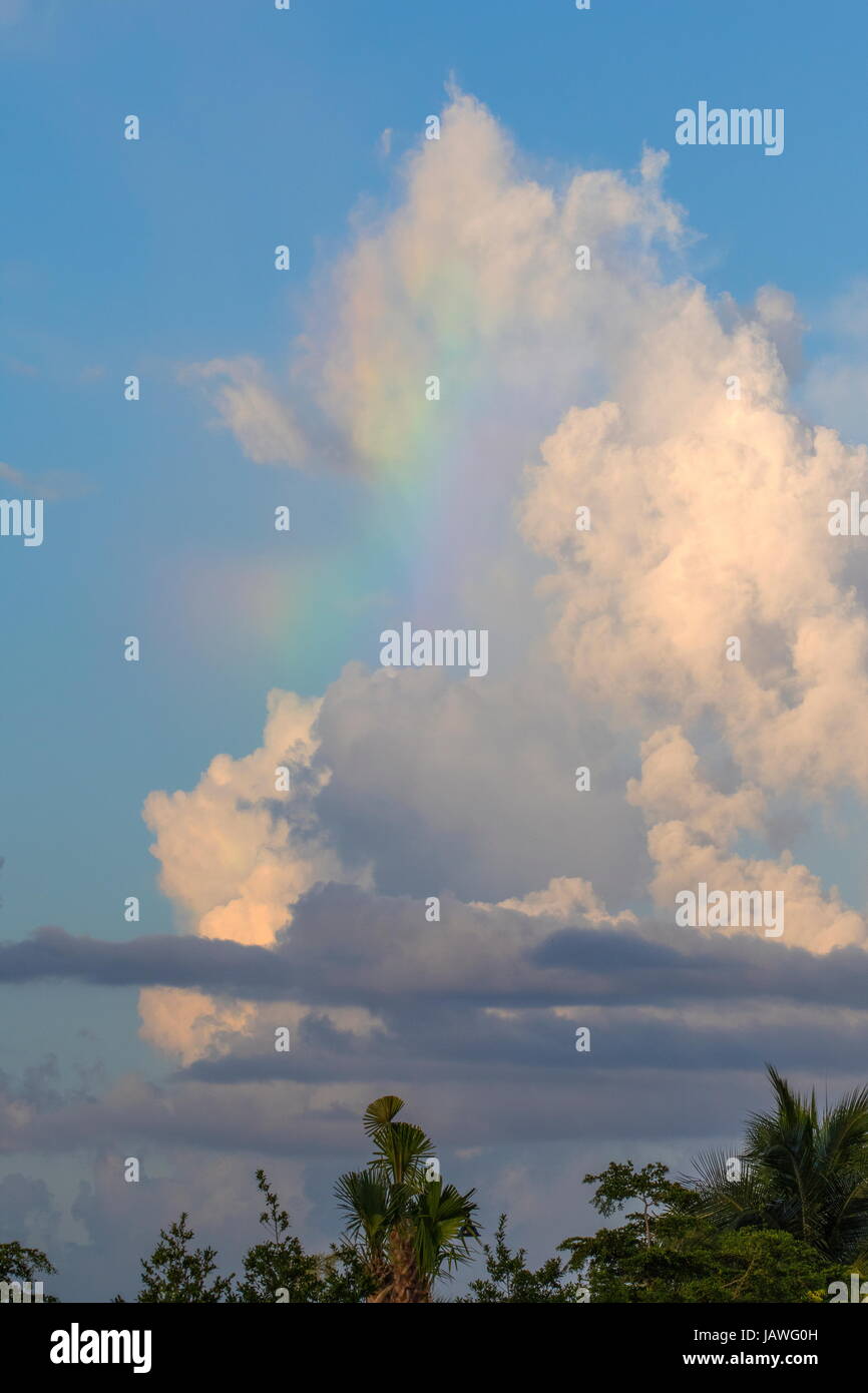 Spectral color among the clouds. Stock Photo