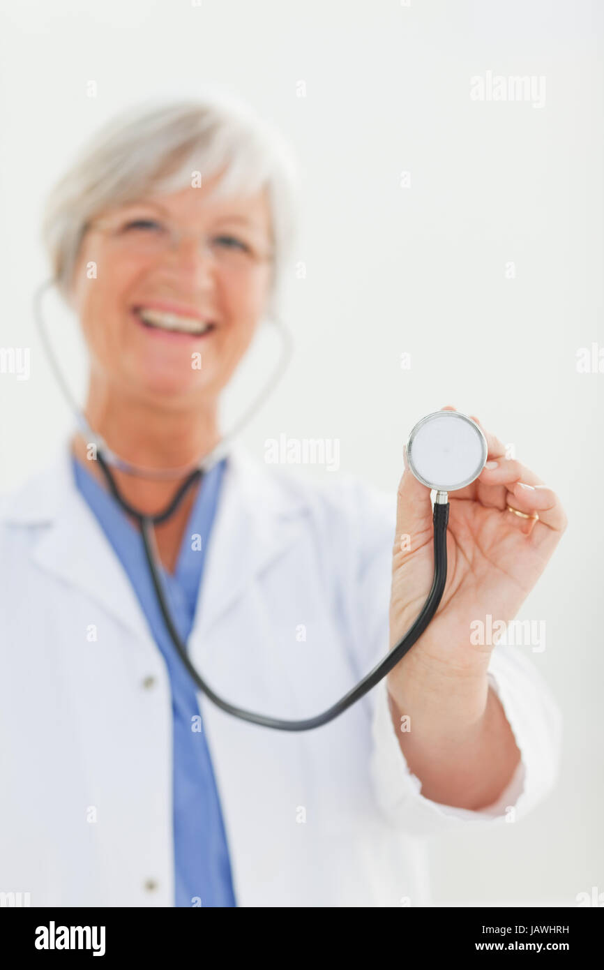 Stethoscope being used by smiling doctor Stock Photo Alamy
