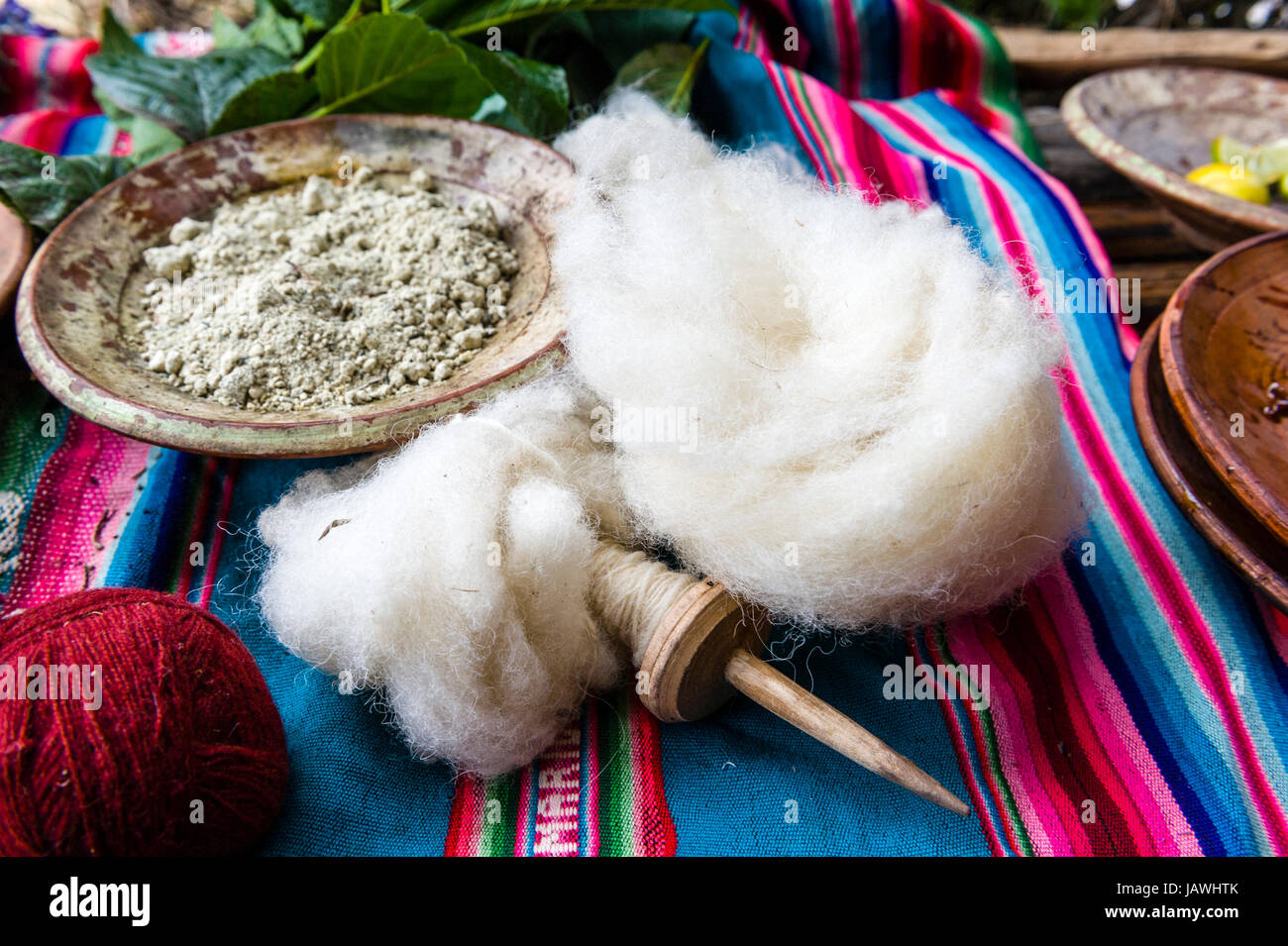 Amaru people using natural dyes to colour sheeps wool for spinning yarn. Stock Photo