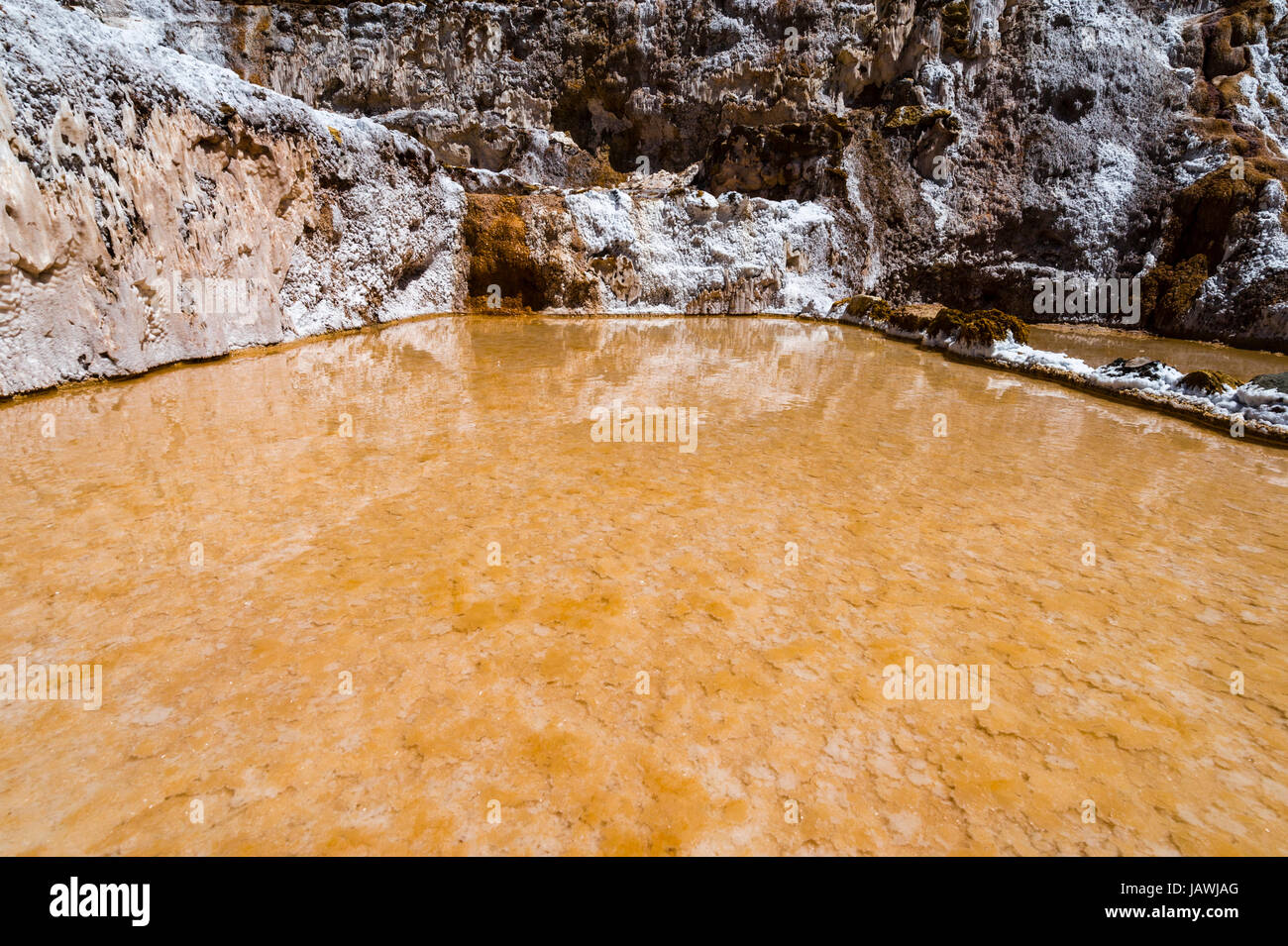 An Inca salt mine made up of salty spring water ponds evaporating. Stock Photo