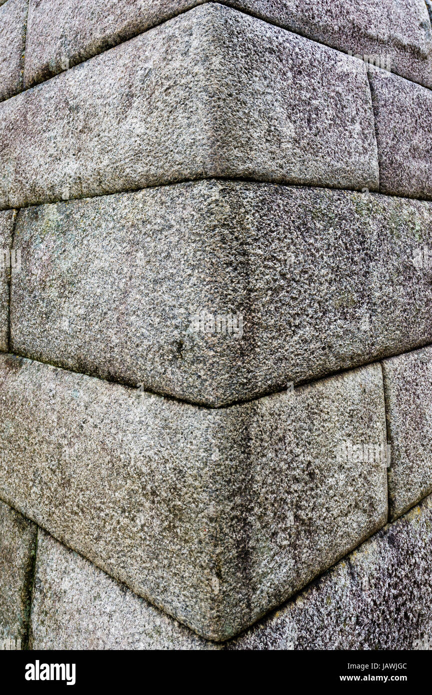 The linear textured corner of a Inca polished dry-stone wall at the Macchu Picchu ruins. Stock Photo