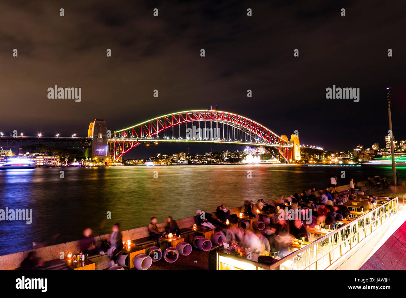 The Sydney Harbour Bridge coloured red during Vivid Sydney Light, Music and Ideas Festival. Stock Photo