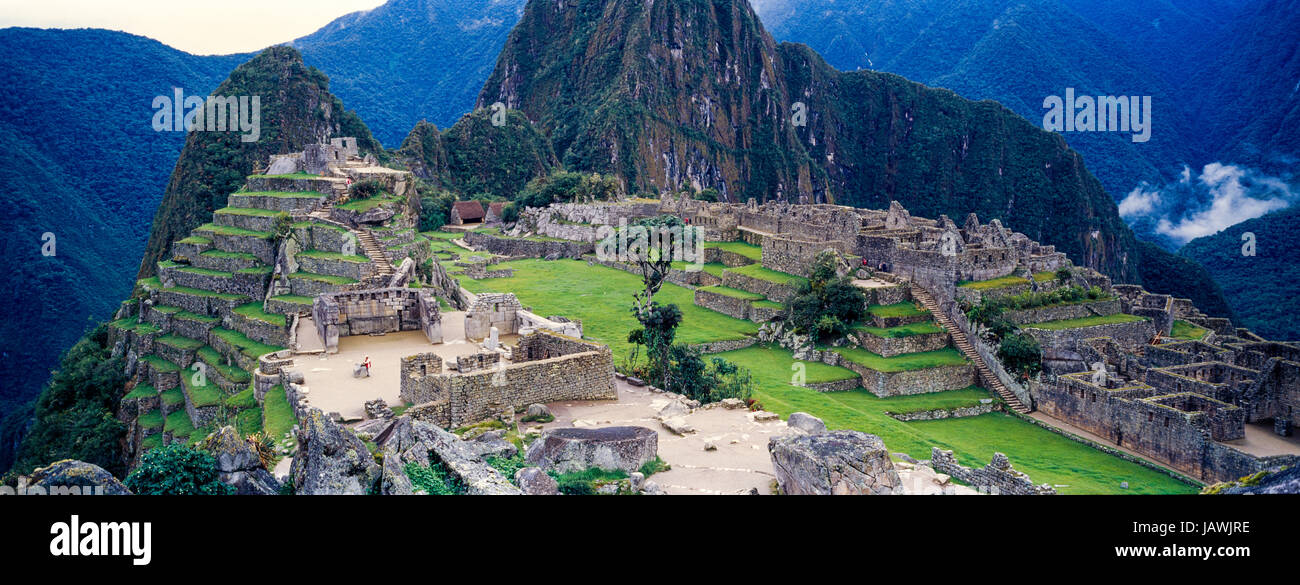 The ancient Inca ruins at the base of Huayna Picchu in the Andes. Stock Photo
