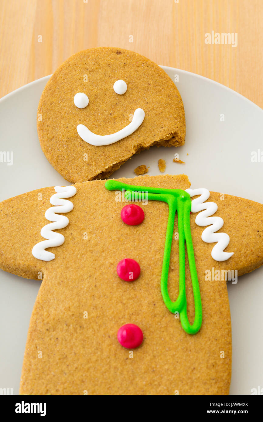 Broken Gingerbread man Stock Photo - Alamy