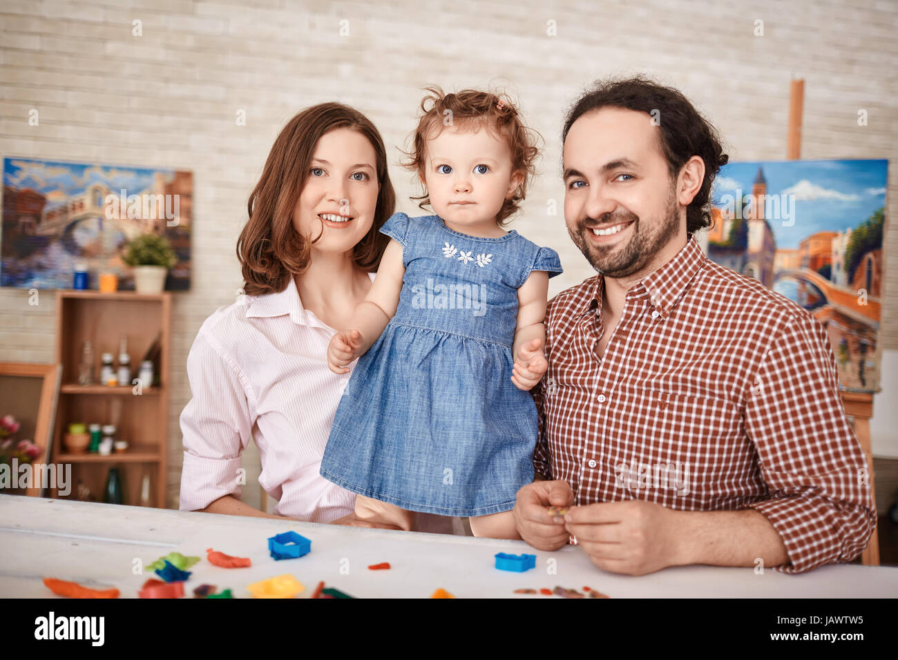 Happy Family Posing for Portrait at Home Stock Photo