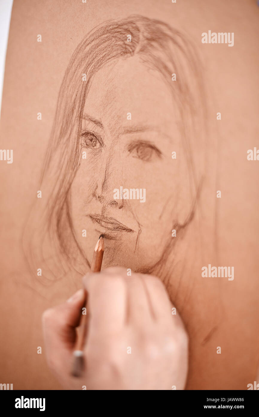 Artist Drawing Sketch of Womans Face Stock Photo