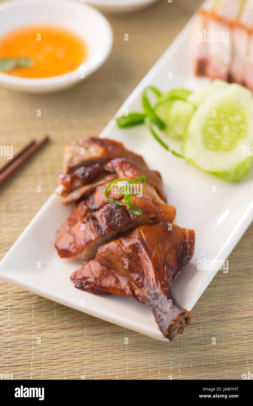 Roasted duck, Chinese style, served with steamed rice on dining table