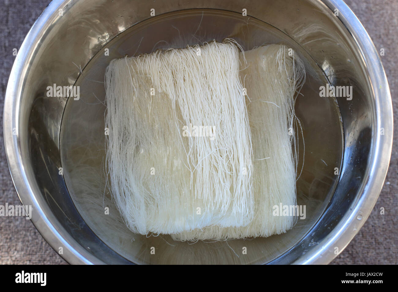 Soaking Vermicelli noodles in water Stock Photo