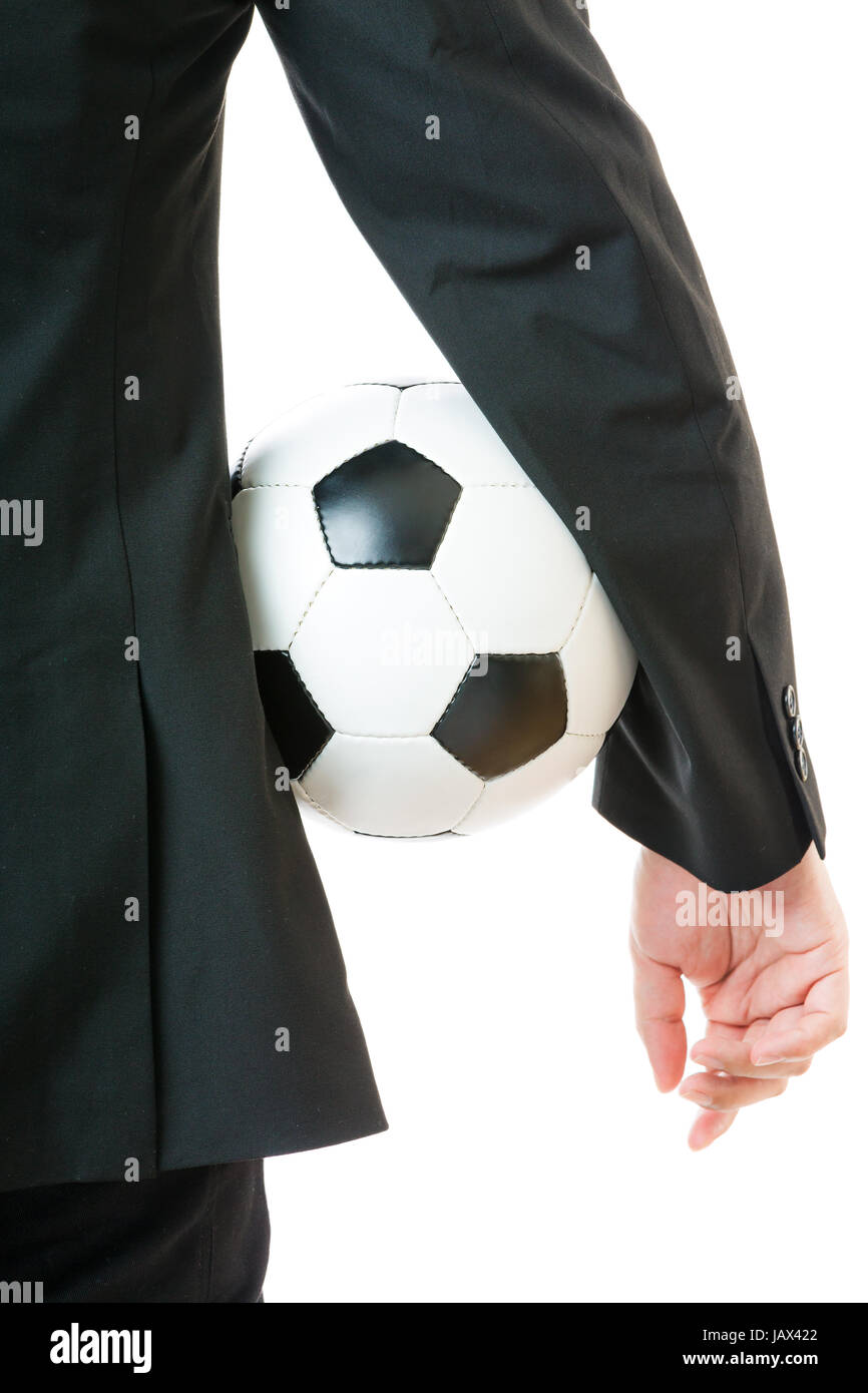 Businessman holding soccer ball Stock Photo - Alamy