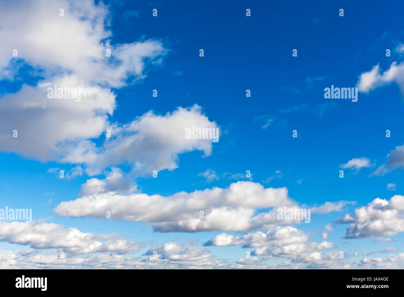 White clouds in blue summer sky background Stock Photo - Alamy