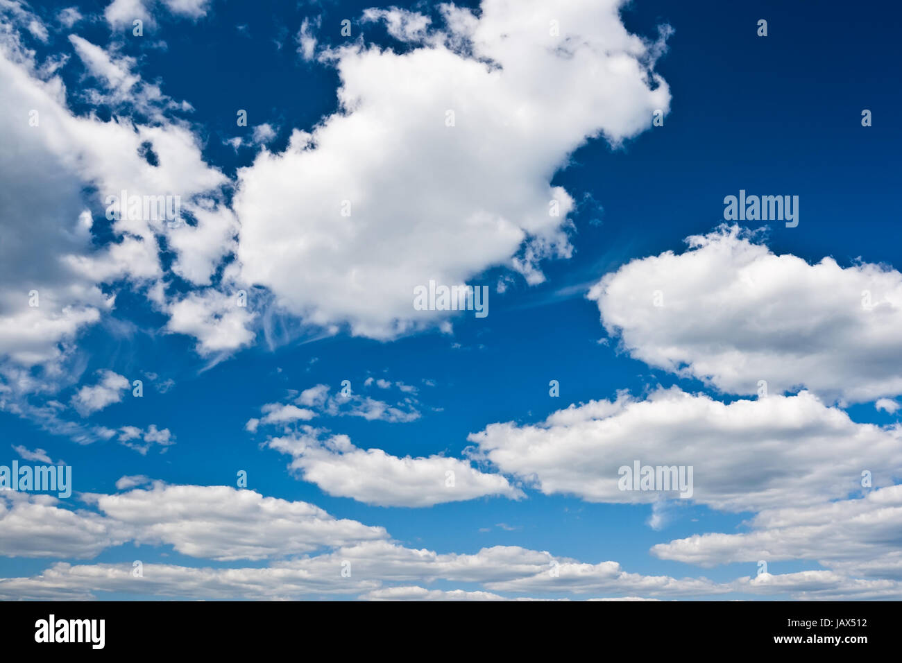 White clouds in blue summer sky background Stock Photo - Alamy