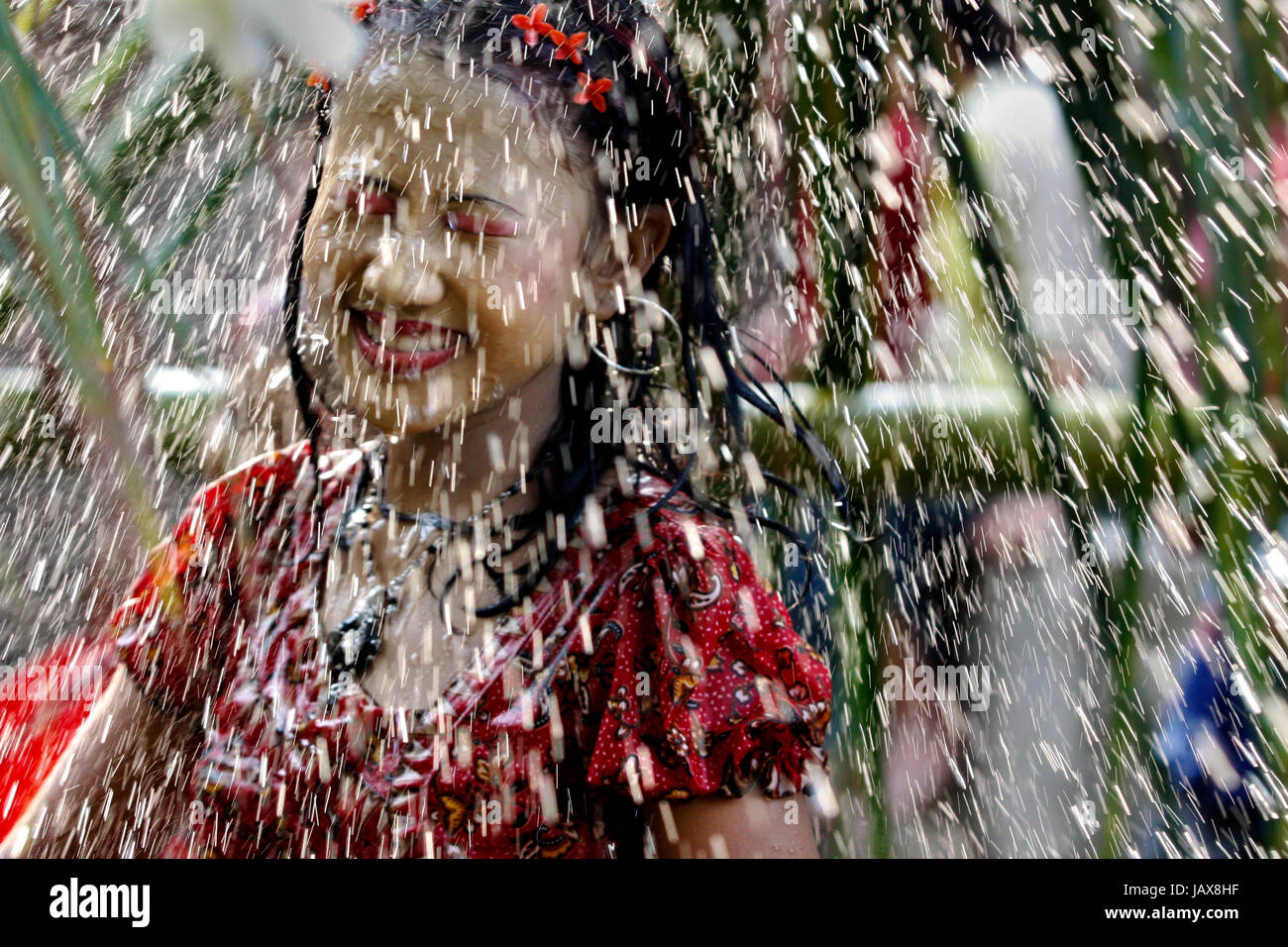 The Water Festival of the ethnic Rakhain community is a part of their New Year celebration. Young boys and girls throw water at each other during this Stock Photo