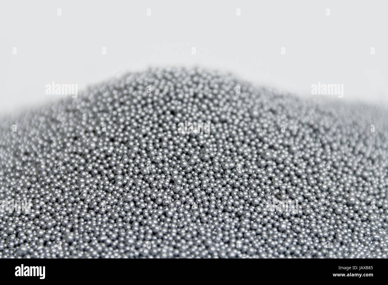 pile of silver metallic beadlets in light back Stock Photo