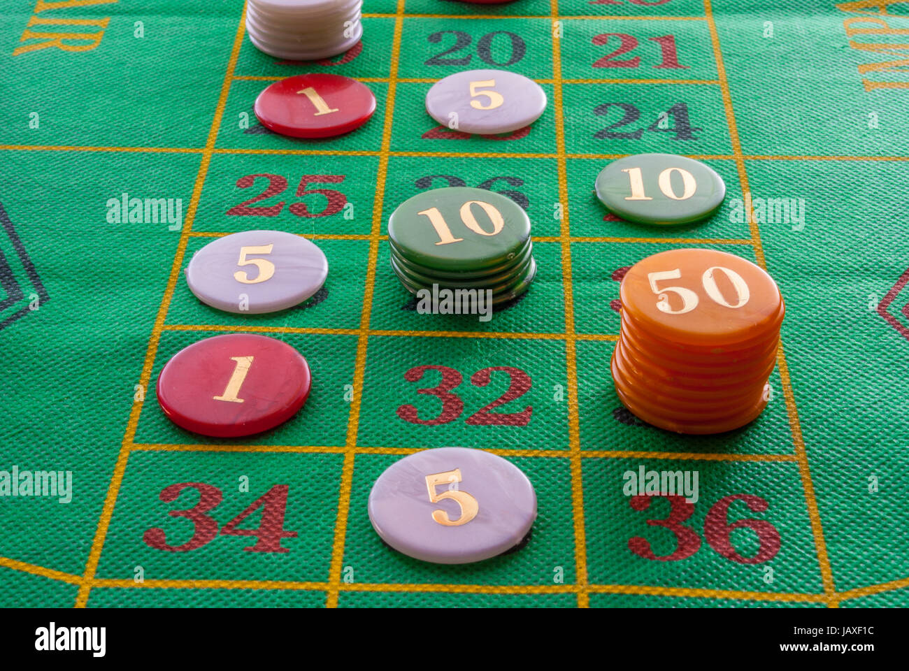 roulette game with game table and green poker chips Stock Photo