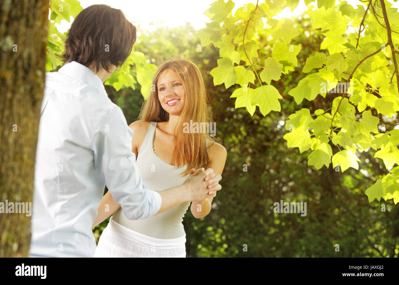 a young couple in love having fun in the park Stock Photo - Alamy