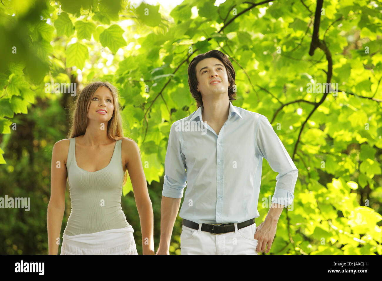 a young couple in love walking in the park Stock Photo - Alamy