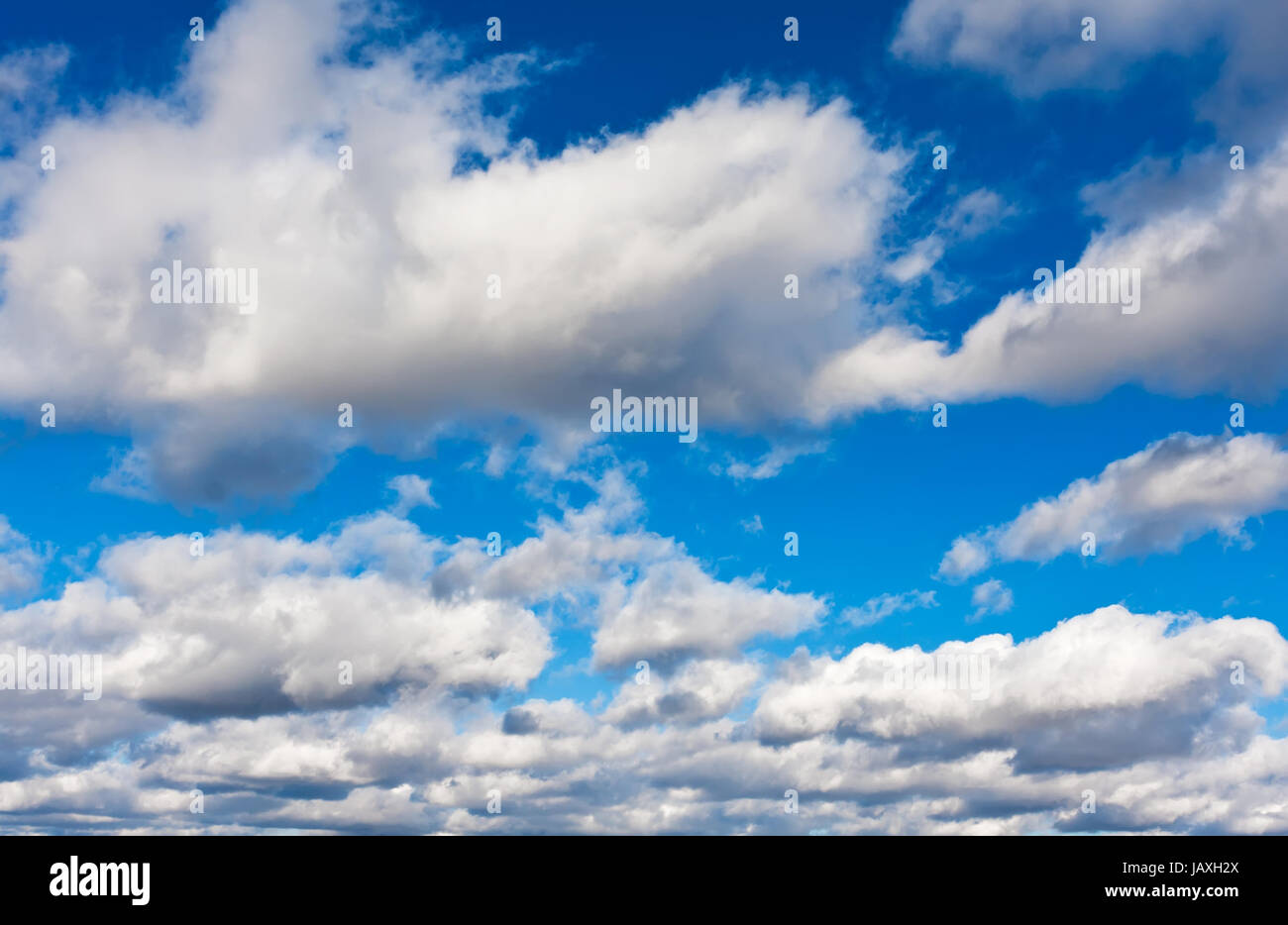 White clouds in blue summer sky background Stock Photo - Alamy