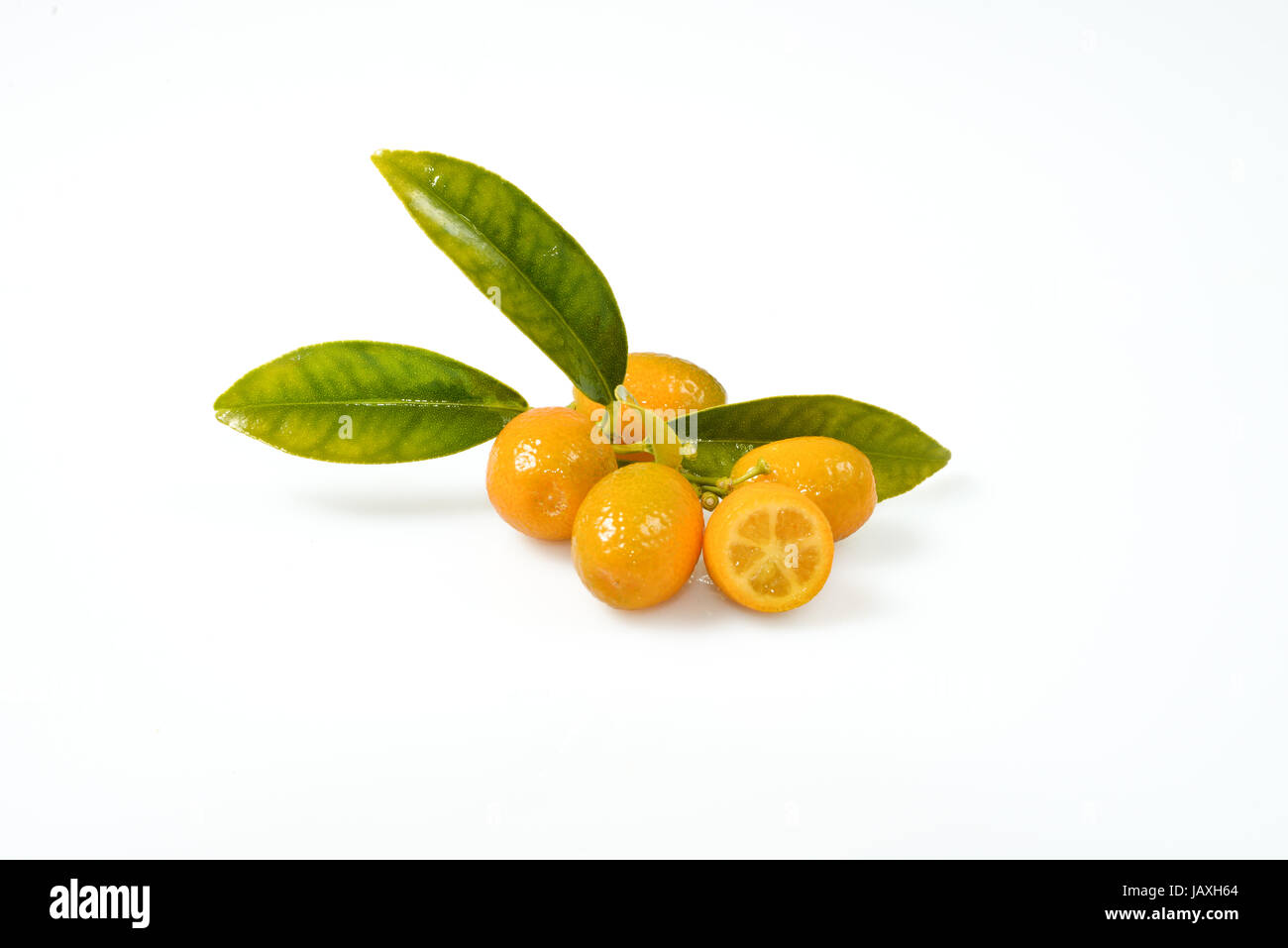 Ripe citrus with a green leaf on a white background Stock Photo