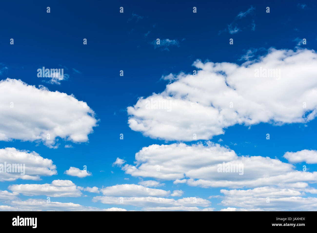 White clouds in blue summer sky background Stock Photo - Alamy