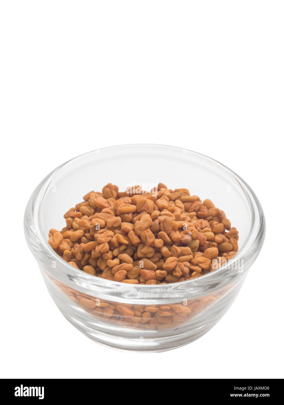 close up of a bowl of indian fenugreek seeds isolated Stock Photo