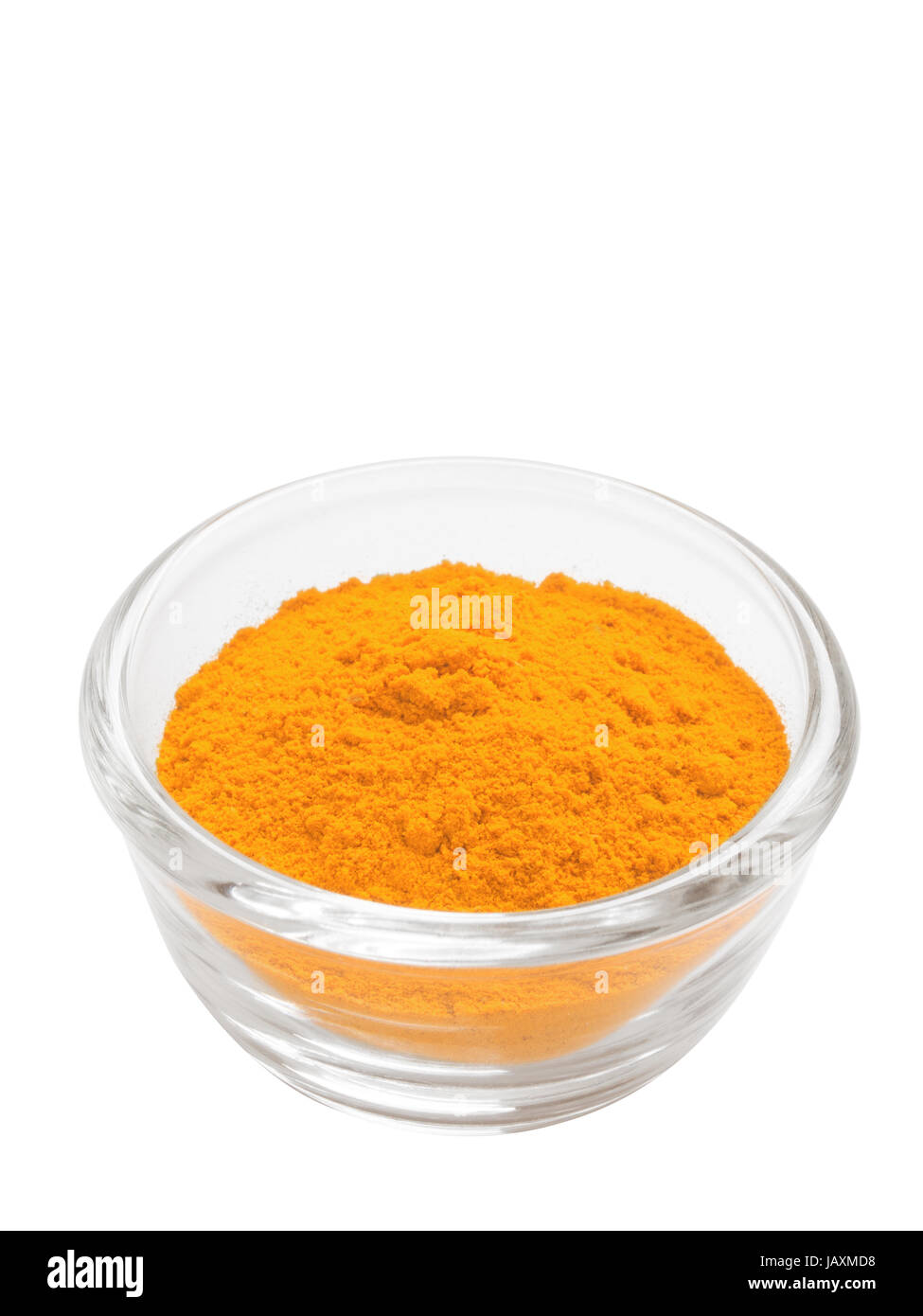 close up of a bowl of grounded indian turmeric powder isolated Stock Photo